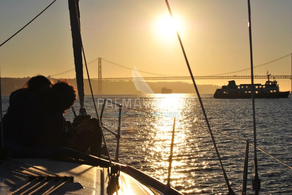 A couple on a romantic boat tour is Lisbon