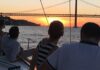 Lisbon Sunset Cruise group sailing in the Tagus River